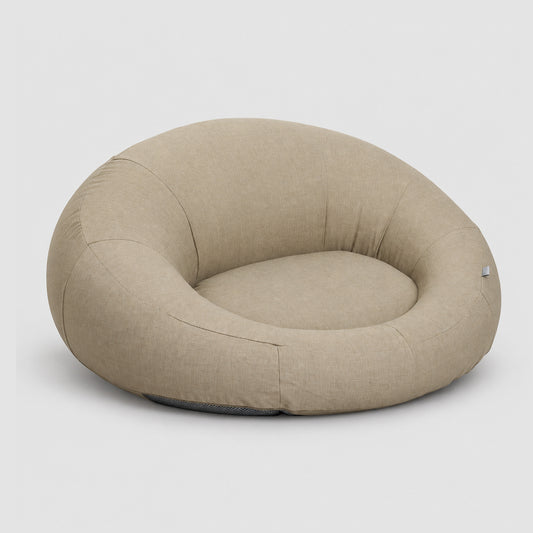 Poolboy Floata-Round in Natural beige, three-quarter view.