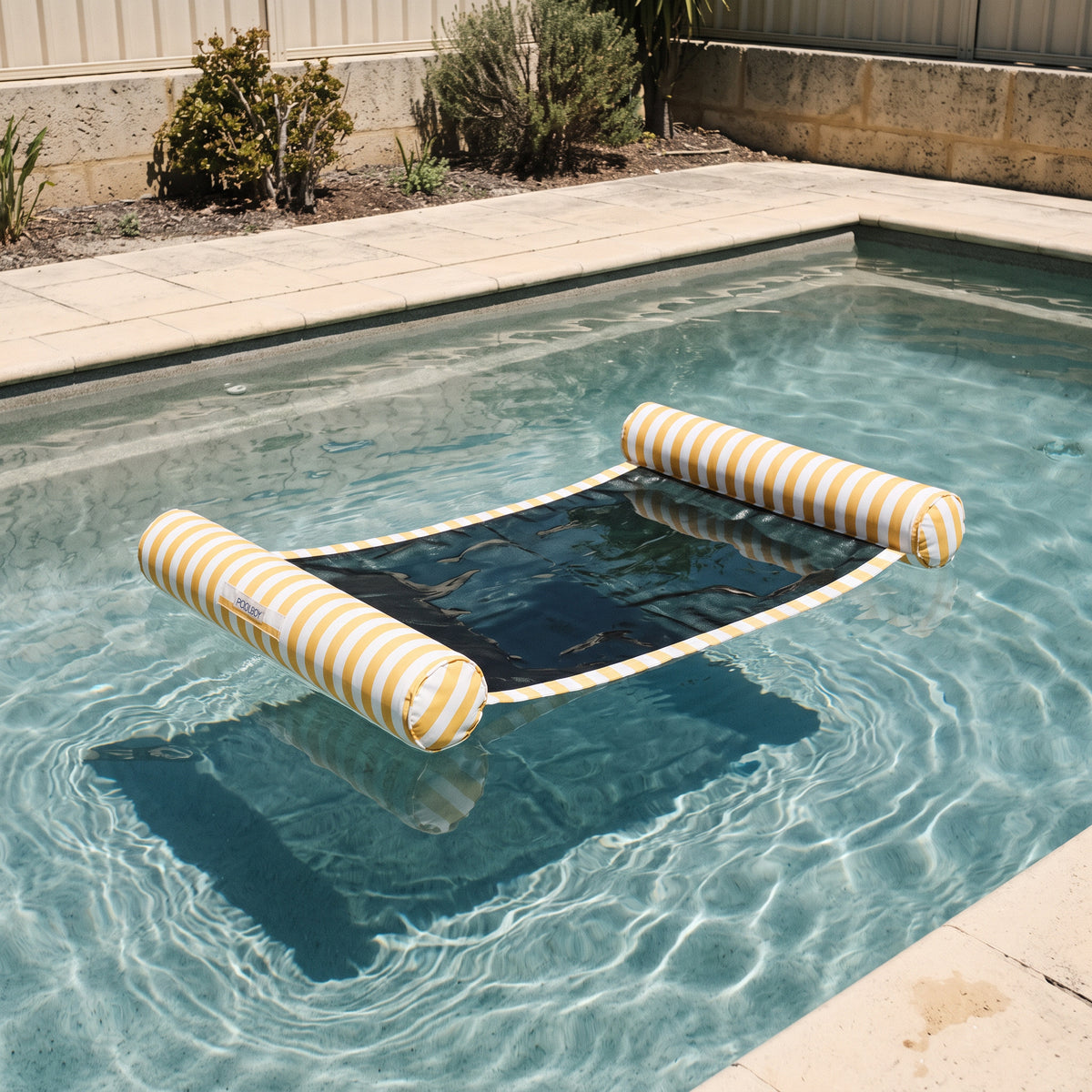Poolboy Sinka-Bit in Yellow and White stripe on the water.